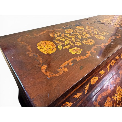 575 - A Dutch mahogany and marquetry inlaid bombe cylinder bureau, decorated throughout with intricate flo... 
