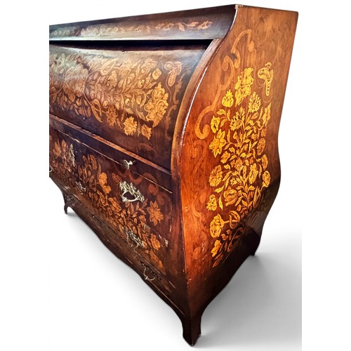 575 - A Dutch mahogany and marquetry inlaid bombe cylinder bureau, decorated throughout with intricate flo... 