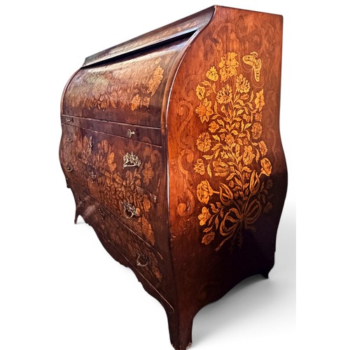 575 - A Dutch mahogany and marquetry inlaid bombe cylinder bureau, decorated throughout with intricate flo... 