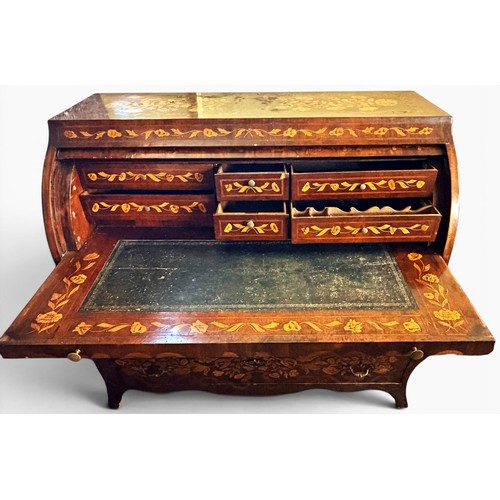 575 - A Dutch mahogany and marquetry inlaid bombe cylinder bureau, decorated throughout with intricate flo... 