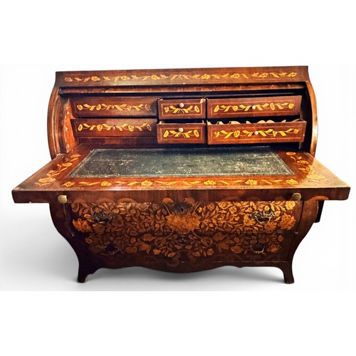 575 - A Dutch mahogany and marquetry inlaid bombe cylinder bureau, decorated throughout with intricate flo... 