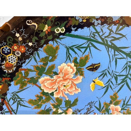 473 - An unusually large Japanese cloisonné enamel charger, decorated with cranes, sparrows and butterflie... 