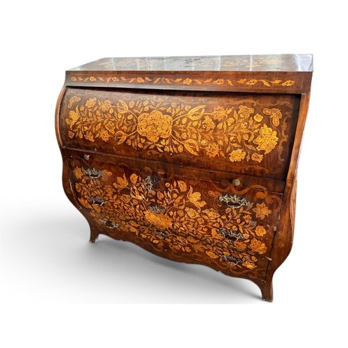 575 - A Dutch mahogany and marquetry inlaid bombe cylinder bureau, decorated throughout with intricate flo... 