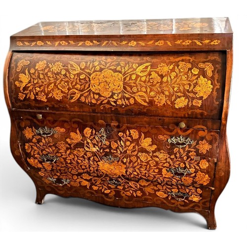 575 - A Dutch mahogany and marquetry inlaid bombe cylinder bureau, decorated throughout with intricate flo... 