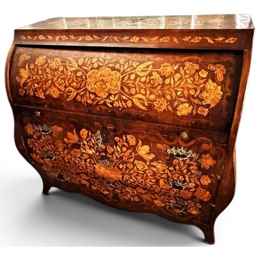 575 - A Dutch mahogany and marquetry inlaid bombe cylinder bureau, decorated throughout with intricate flo... 