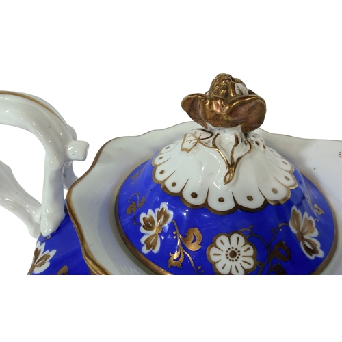 30 - A 19th century blue and white tea service in the Rockingham style with a bright gilt overlay. Compri... 