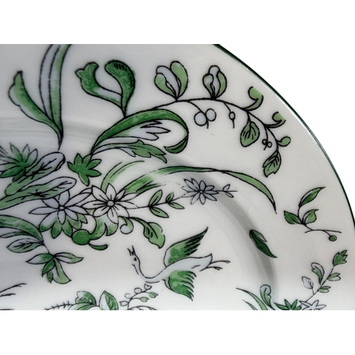 4 - A Limoges porcelain dinner service in the Parsifal pattern in a green colour way, comprising of grad... 