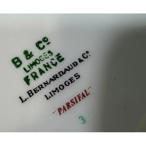 4 - A Limoges porcelain dinner service in the Parsifal pattern in a green colour way, comprising of grad... 