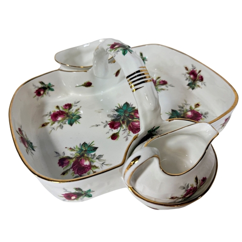 42 - A Hammersley strawberry dish with sugar and cream compartments, a pair of large German porcelain ser... 