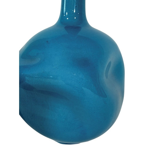 47 - Two Burmantofts vases in a turquoise glaze, each with dimpled bodies, one with a drawn neck, the oth... 