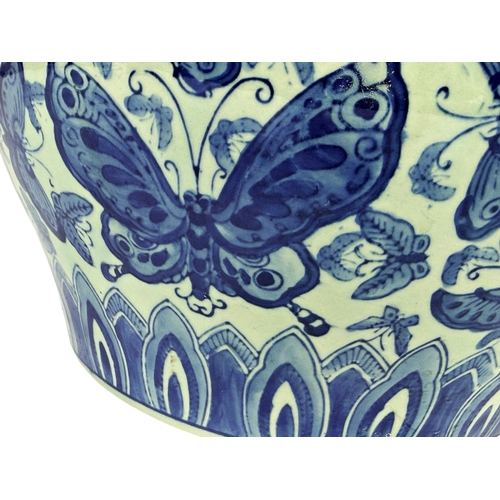 54 - A 20th century Chinese carp bowl with detail showing butterflies. 31cm in diameter.