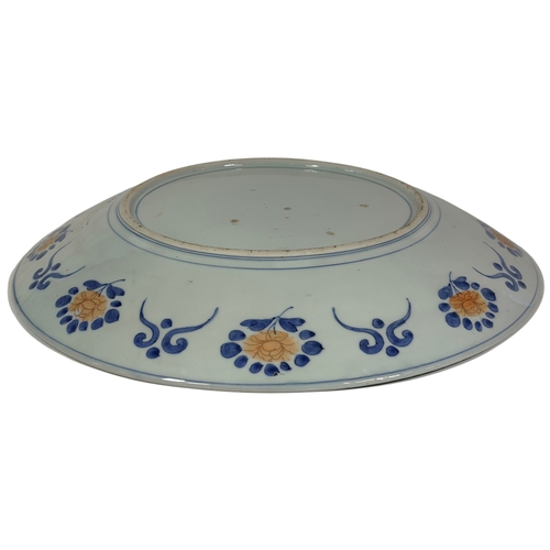 55 - A large 19th century Imari charger with a repeating floral and other detail. 45cm in diameter.