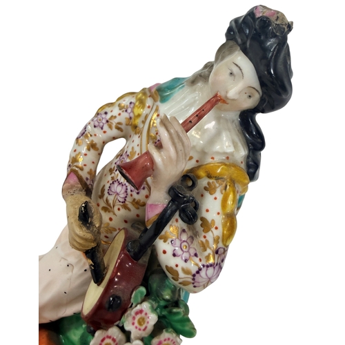 58 - An 18th century Derby porcelain figure of a piper (restored). 22cm in height.
