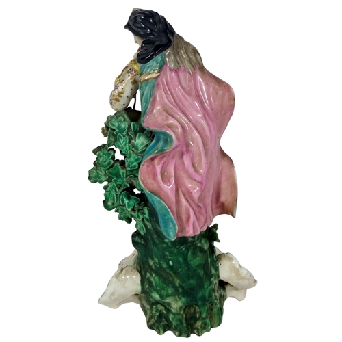 58 - An 18th century Derby porcelain figure of a piper (restored). 22cm in height.