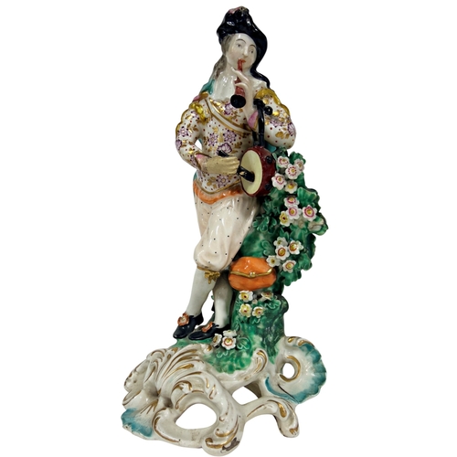 58 - An 18th century Derby porcelain figure of a piper (restored). 22cm in height.