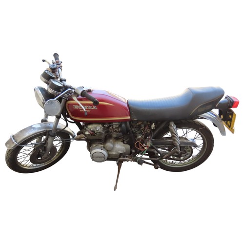 A Honda CB400F, red, registration THR 149S, registered 17.4.1978, V5C and key present, kicks over and gear change operational. A dry barn find (af).