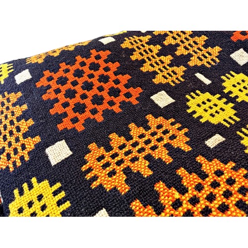 659 - A good traditional Welsh wool rug or blanket, in shades of red, ochre, yellow, black and white, 228 ... 