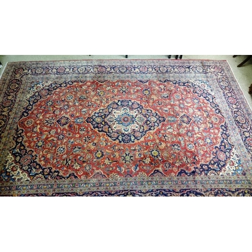 485 - Very Large Red Ground Persian Kashan Carpet with medallion design, c.13ft8 x 6ft (4.18m x 2.88m)