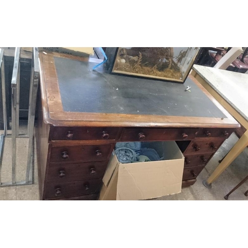 536 - Victorian Walnut Pedestal Desk with an arrangement of nine drawers