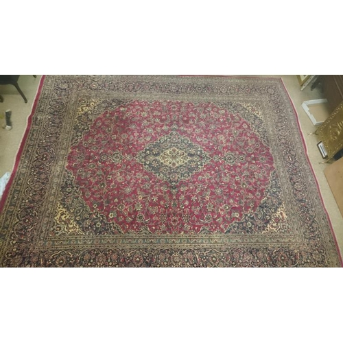 430 - Large Red Ground Kashan Carpet with traditional all-over medallion design, c.10ft x 12ft