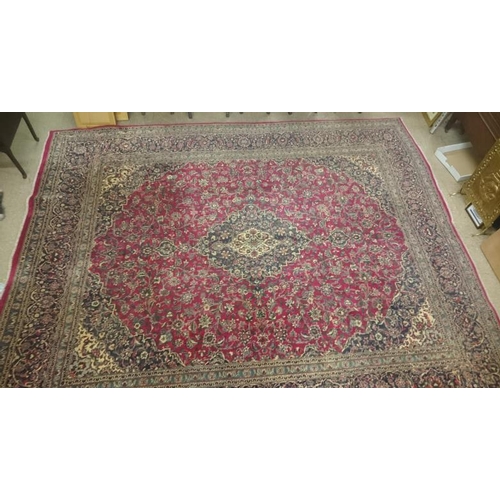 430 - Large Red Ground Kashan Carpet with traditional all-over medallion design, c.10ft x 12ft