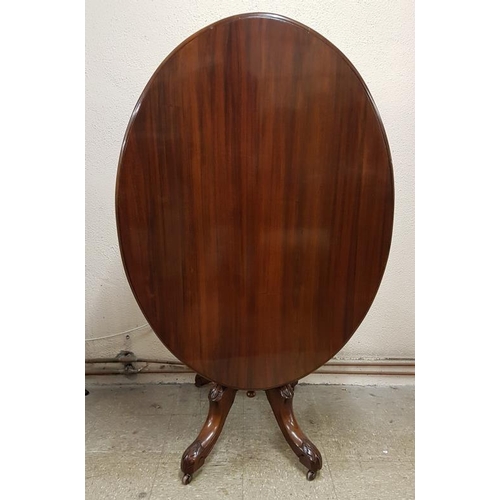 456 - Fine Quality Mahogany Tilt Top Breakfast Table, the Oval top on a Turned Column and Four Carved and ... 