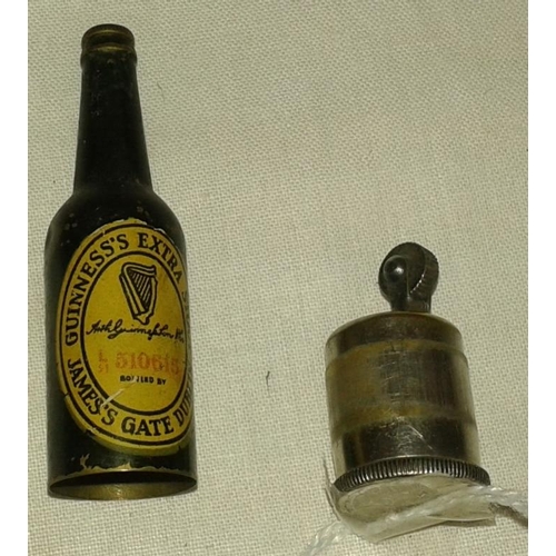 235 - Cigarette Lighter in the form of a Mini Guinness Bottle