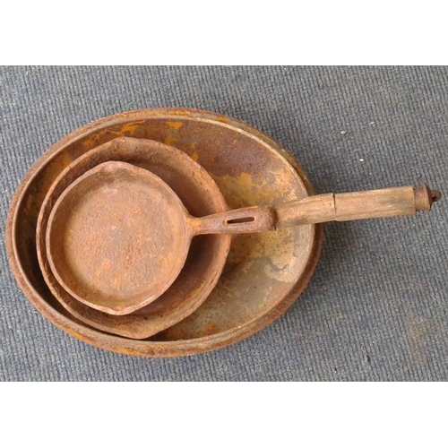 46 - Two Cast Iron Pans and an Old Pot Lid