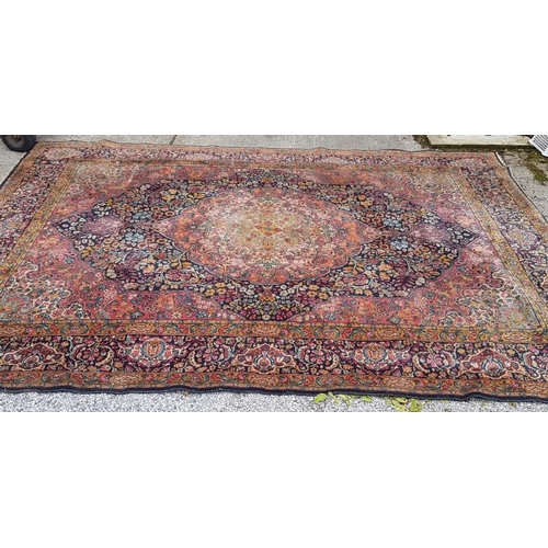 602 - Floral Pattern Floor Rug on a red ground (some wear)