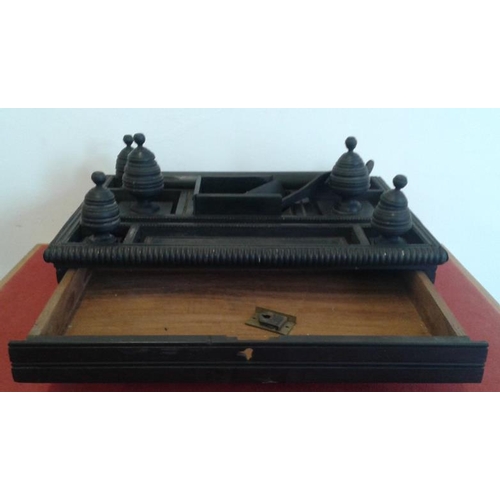 612 - Eastern Ebony Desk Stand with a base drawer, c.14 x 11in