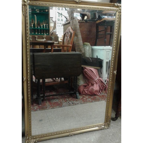 394 - Pair of Decorative Gilt Framed and Bevelled Wall Mirrors, c.27 x 39in