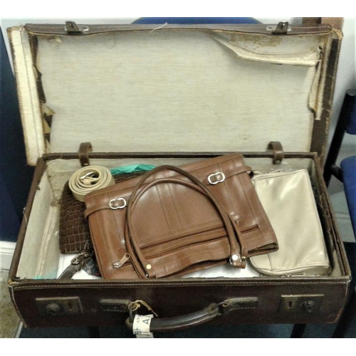 32 - Leather Suitcase and Contents