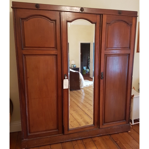 33 - Edwardian Mahogany Three Door Wardrobe with central mirror panel door flanked by a pair of solid pan... 