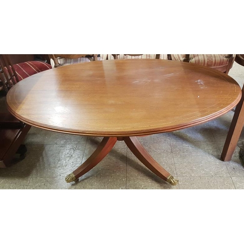 609 - Inlaid Mahogany Coffee Table of Oval Form on a four splay pod with brass Lion's paw feet, c.47in x 2... 