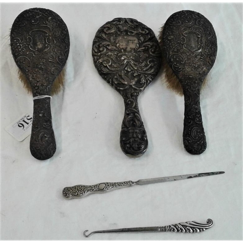 516 - Two Silver Backed Brushes, a hand mirror, button hook and letter opener, c.800grams
