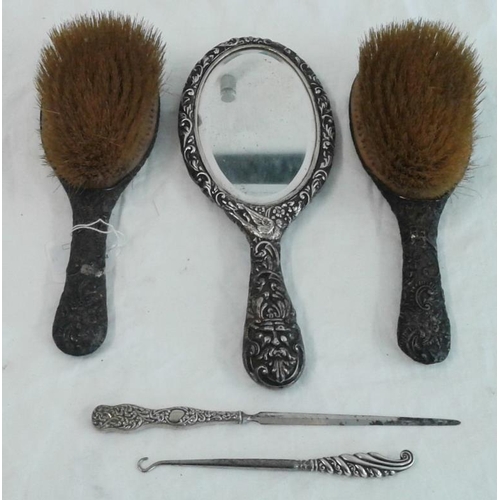 516 - Two Silver Backed Brushes, a hand mirror, button hook and letter opener, c.800grams