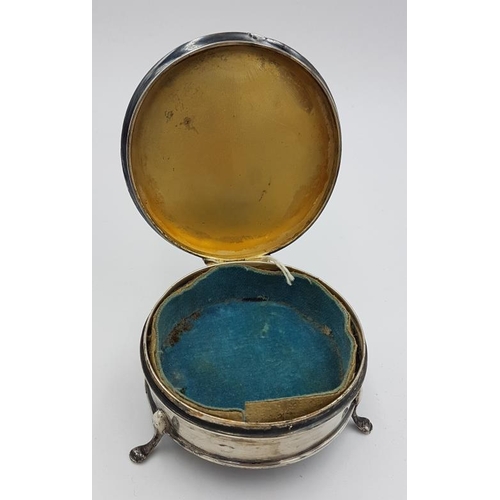 413 - Silver Trinket Box with Sunburst detail on lid, gilded and blue velvet interior and raised on pad fe... 