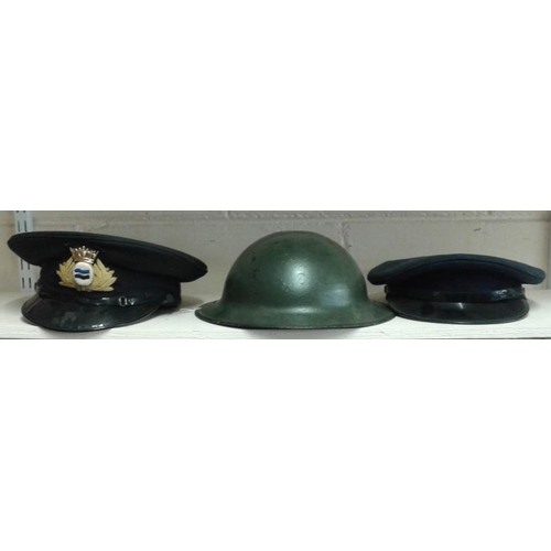 304 - Two Service Caps and an Army Helmet