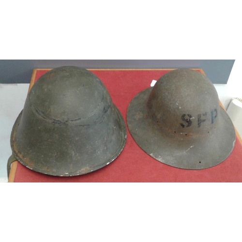 305 - Two World War II Helmets