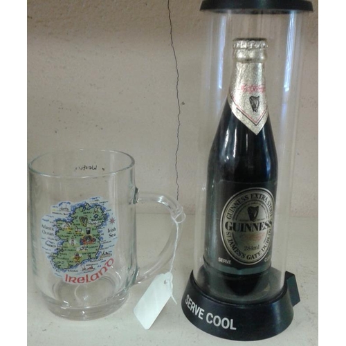 390 - Bottle of Guinness in Clear Plastic Stand and a Pint Glass with Map of Ireland on the side