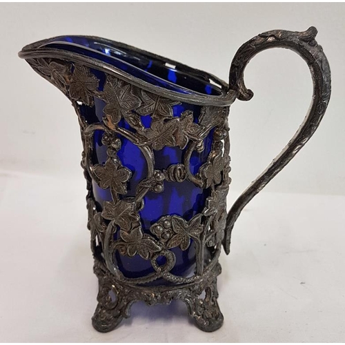 310 - Highly Decorative Victorian Pewter Cream Jug with original bristol blue liner, c.4.5in tall