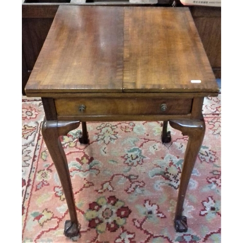 614 - Crossbanded Mahogany Folding Card Table on cabriole legs and ball and claw feet, c.21in wide closed