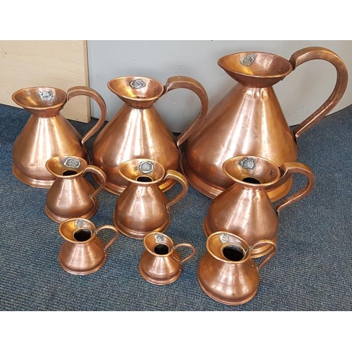 660 - Set of Nine Graduated Copper Measures