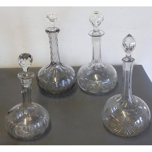 435 - Four Various Mid-19th Century Cut Glass Decanters and Stoppers