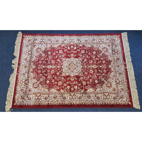 550 - Eastern Floral Pattern Floor Rug on a red ground, c.6ft x 4ft