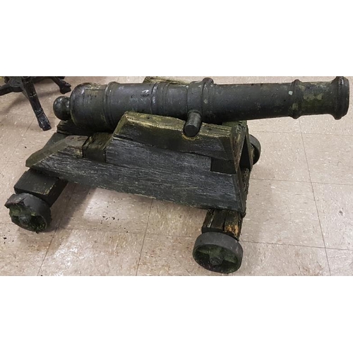 574 - Model Cast Iron Cannon on an oak base - Overall 41ins long x 22.5ins