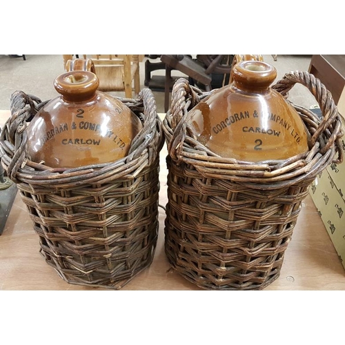 81 - Pair of Corcoran & Co. Ltd., Carlow Two Gallon Whiskey Jars in Original Wicker Casing