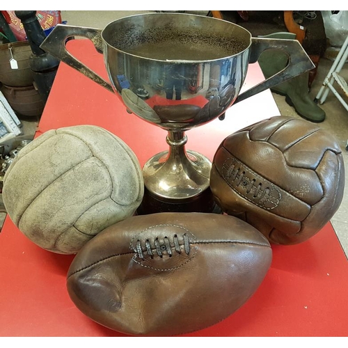 205 - Two Leather Footballs, Leather Rugby Ball and a Trophy