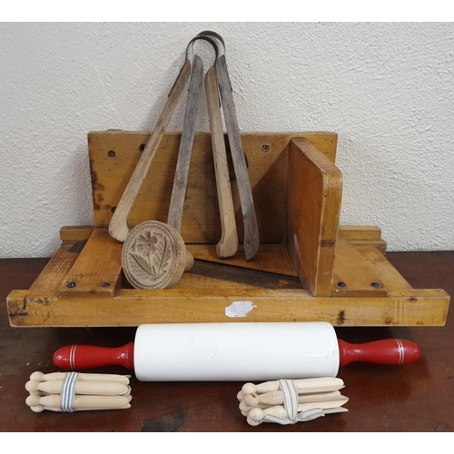 84 - Vintage Bread Slicer, two Clothes Tongs, Wooden Clothes Pegs, a Rolling Pin and a Butter Stamper