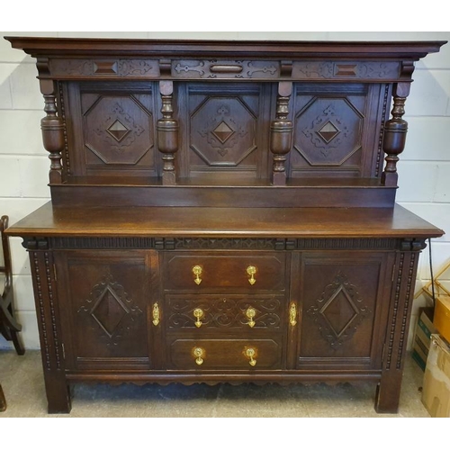 411 - Large Tudor Style Solid Oak Court Cupboard with carved panels and brass detail on drawer fronts and ... 